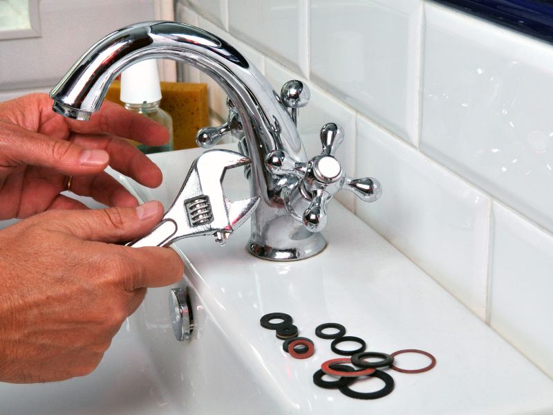Plumbing company in Durban repairing a tap